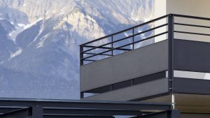 Steel balcony with mountain backdrop